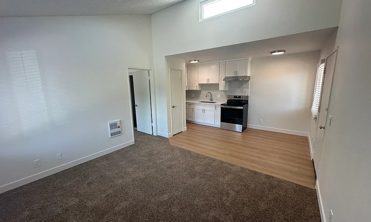 270 W Alamar Ave, renovated open living room and kitchen with vaulted ceiling