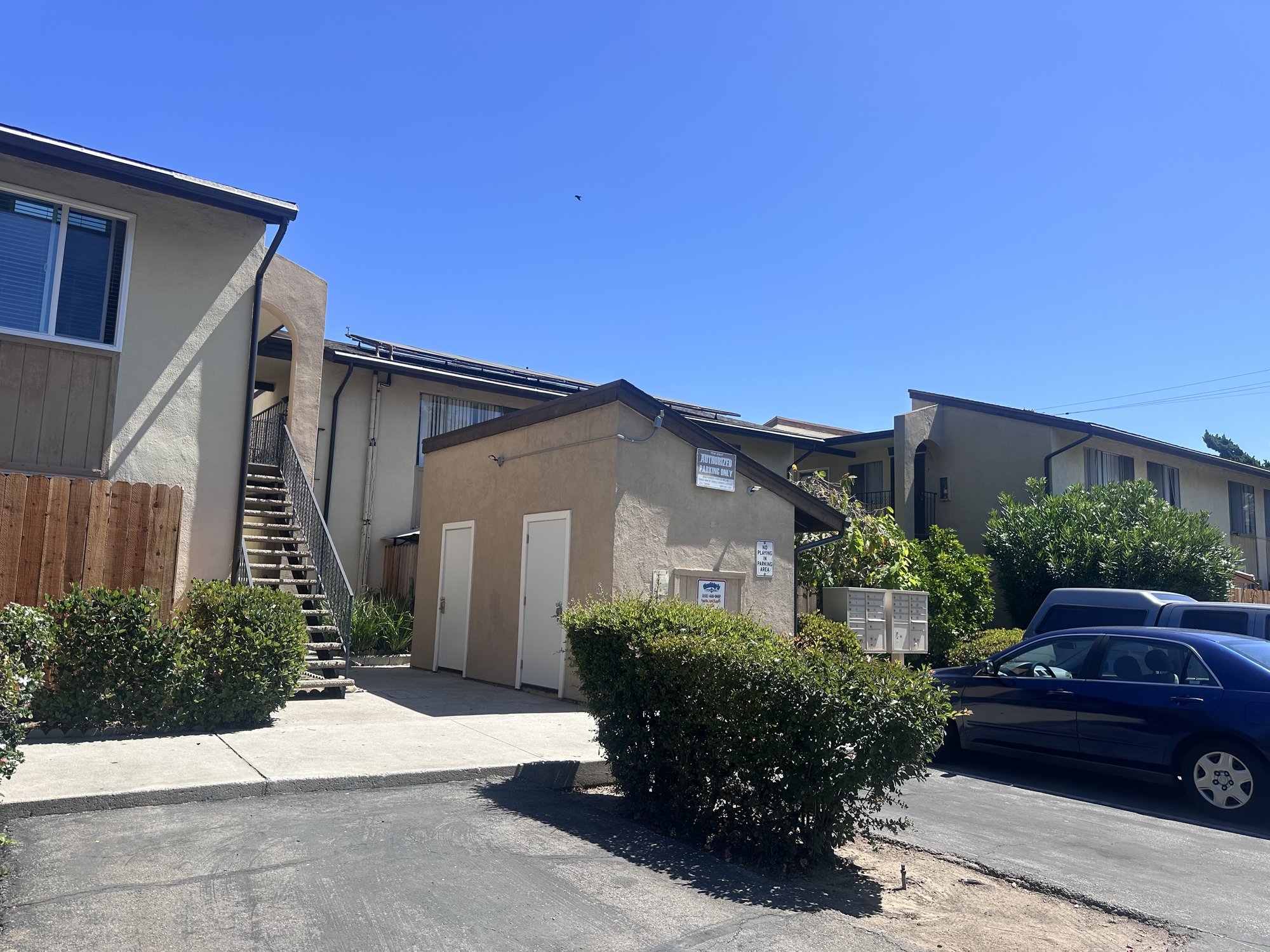270 W Alamar Ave, side view with exterior stair and covered parking